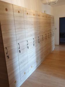a large wooden wall with a bunch of knobs on it at Ubytování Klicperova in Chlumec nad Cidlinou