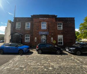three cars parked in front of a hotel at The Harbour Hotel in Greenock