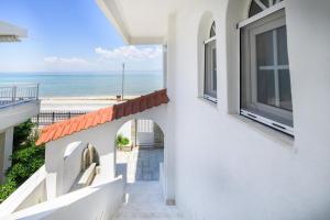 a view of the ocean from the balcony of a house at Cleopatra Residence in Perea