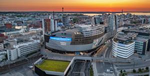 an aerial view of a city at sunset at Lapland Hotels Arena in Tampere