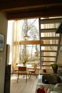 a kitchen with a large window and a table and chairs at Bosco Due in Łagów