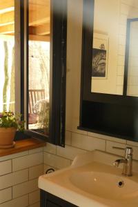 a bathroom with a sink and a window at Bosco Due in Łagów +12 photos