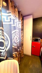 a room with a red refrigerator and a door at Luxury KIA Room D in Richmond Hill