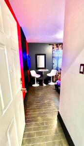 a hallway with a room with a table and stools at Luxury KIA Room D in Richmond Hill