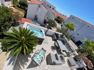 an overhead view of a patio with a swimming pool at Apartments Vodice in Vodice