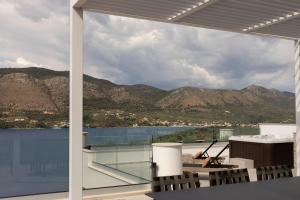 a view of the mountains from the balcony of a house at Ionion exclusive villa in Syvota