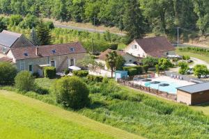 an aerial view of a house with a swimming pool at La Mailleraie - Le Moulin in Valojoulx