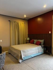 a bedroom with a large bed in a room at Waterland Suites in Paramaribo +128 photos