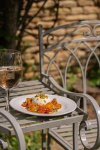 a plate of food and a glass of wine on a table at The Market Tavern in Bampton +116 photos