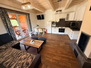 a living room with a couch and a table at Chata do Zlatneho in Terchová +26 photos
