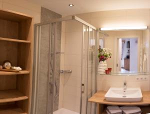 a bathroom with a shower and a sink at Lochgrubgut in Altenmarkt im Pongau +54 photos