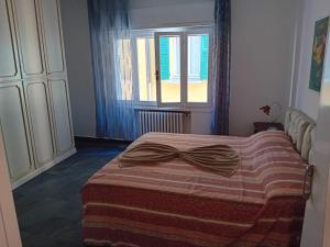 a bedroom with a bed with a bow on it at Guest House Soma Montecchio in Montecchio Emilia