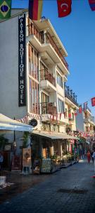 a large building on the side of a street at Patron Hotel in Antalya