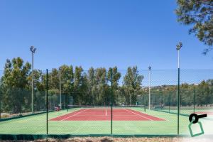a tennis court with a net on top of it at Hotiday Punta Sardegna in Palau