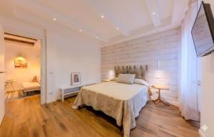 a bedroom with a bed and a table in a room at Oltre il Borgo in Valentano