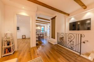 an open living room with a staircase and a dining room at Oltre il Borgo in Valentano