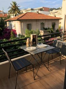 a table and chairs sitting on a balcony at STUDIO by the croisette in Cannes