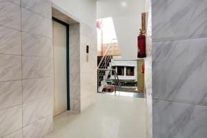 an empty hallway with a door in a building at Hotel O Jammu Near Ragunath Bazaar Formerly GoodWill in Jammu +27 photos