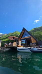 a house on a boat on the water at Omorika Perućac Splav in Gaočići