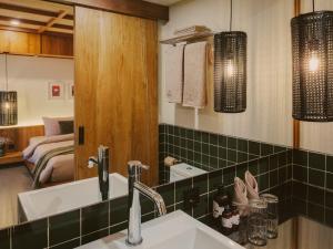 a bathroom with a sink and a mirror at Anandaya Sanur in Sanur +45 photos