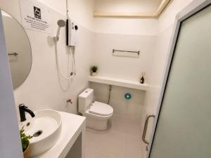 a bathroom with a toilet and a sink at Dive In Koh Tao in Ko Tao
