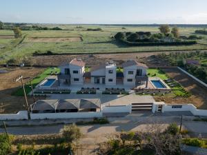 an aerial view of a house in a field at Forestbreeze in Metóchion