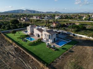 an aerial view of a large house with a yard at Forestbreeze in Metóchion