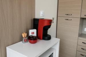 a coffee maker sitting on a counter in a kitchen at ValtellinaHome in Villa di Tirano