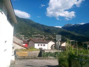 a view of a town with mountains in the background at Casa Ines in Bellinzona