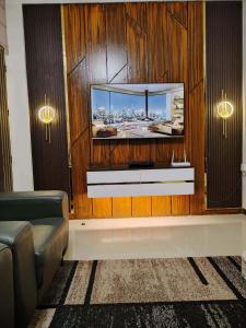 a flat screen tv on a wall in a room at The Barracks Staycation - Transient in Santa Rosa