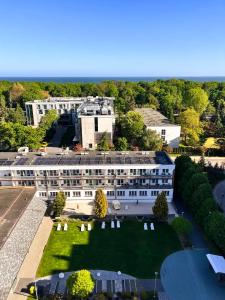 an aerial view of a building with a yard at San Medical Spa in Kołobrzeg