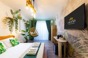 a living room with a couch and a table at Eteria Luxury Rooms Spa & Wellness in Posada