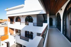 an external view of a building with a balcony at Tepi Segara Seminyak in Seminyak
