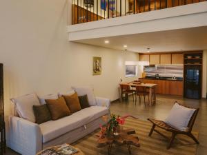 a living room with a couch and a table at Anandaya Sanur in Sanur