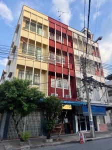 a tall building on a city street at Room with a Temple View in Bangkok