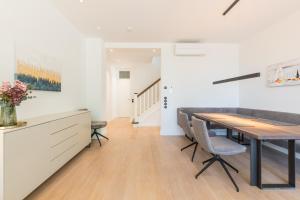 a kitchen and dining room with a table and chairs at Strandvilla Lilli in Timmendorfer Strand