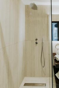 a shower with a glass door in a bathroom at Breathtaking view guesthouse2 in Psalidi +23 photos