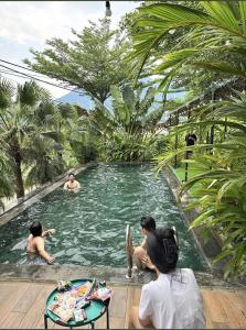 a group of people in a swimming pool at Greenfield Ba Vì - Nắng Villa in Yên Bài