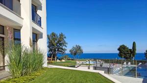 a building with a view of the ocean at Skyline Apartments - Sea View, Pools, SPA&Free Parking in Varna City