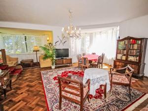 a living room with a table and chairs at Villa Forestside Villa by Interhome in Planá nad Lužnicí