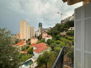 a view of a city from a balcony of a building at Frontière de Monaco - Spacieux et confortable - GM in Beausoleil