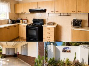 a kitchen with wooden cabinets and a black stove at The Big Five Bed and breakfast in Mooiriver