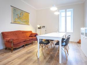 a living room with a table and a couch at Apartment Bacolla by Interhome in Cocconato