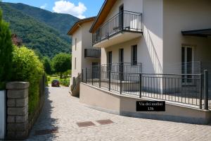 a building with a sign on the side of it at ValtellinaSuite in Villa di Tirano +7 photos