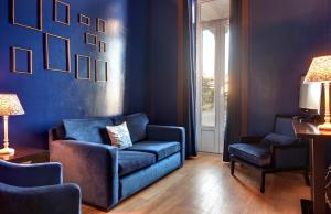 Uma área de estar em Hotel Inglaterra - Charme & Boutique