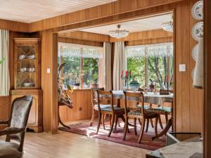 a dining room with a table and chairs at Holiday Home Extorp by Interhome in Hamneda