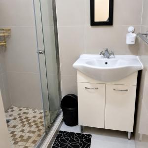 a bathroom with a sink and a shower at The Big Five Bed and breakfast in Mooiriver