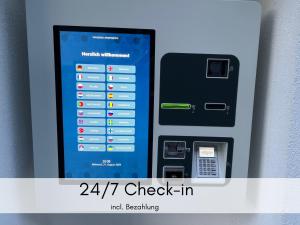 an image of an atm machine with the words check in at Holledau-Apartments - Auszeit im schönen Hopfenland in Bayern - voll ausgestattete Apartments - Garten - Balkon - Nähe München in Osterwaal