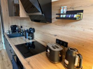 a kitchen with a counter top with a toaster at Urlaub Schwarzwaldliebe in Bad Teinach-Zavelstein