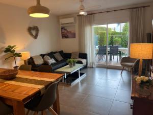 a living room with a couch and a table at Breda 4a in Torroella de Montgrí +38 photos